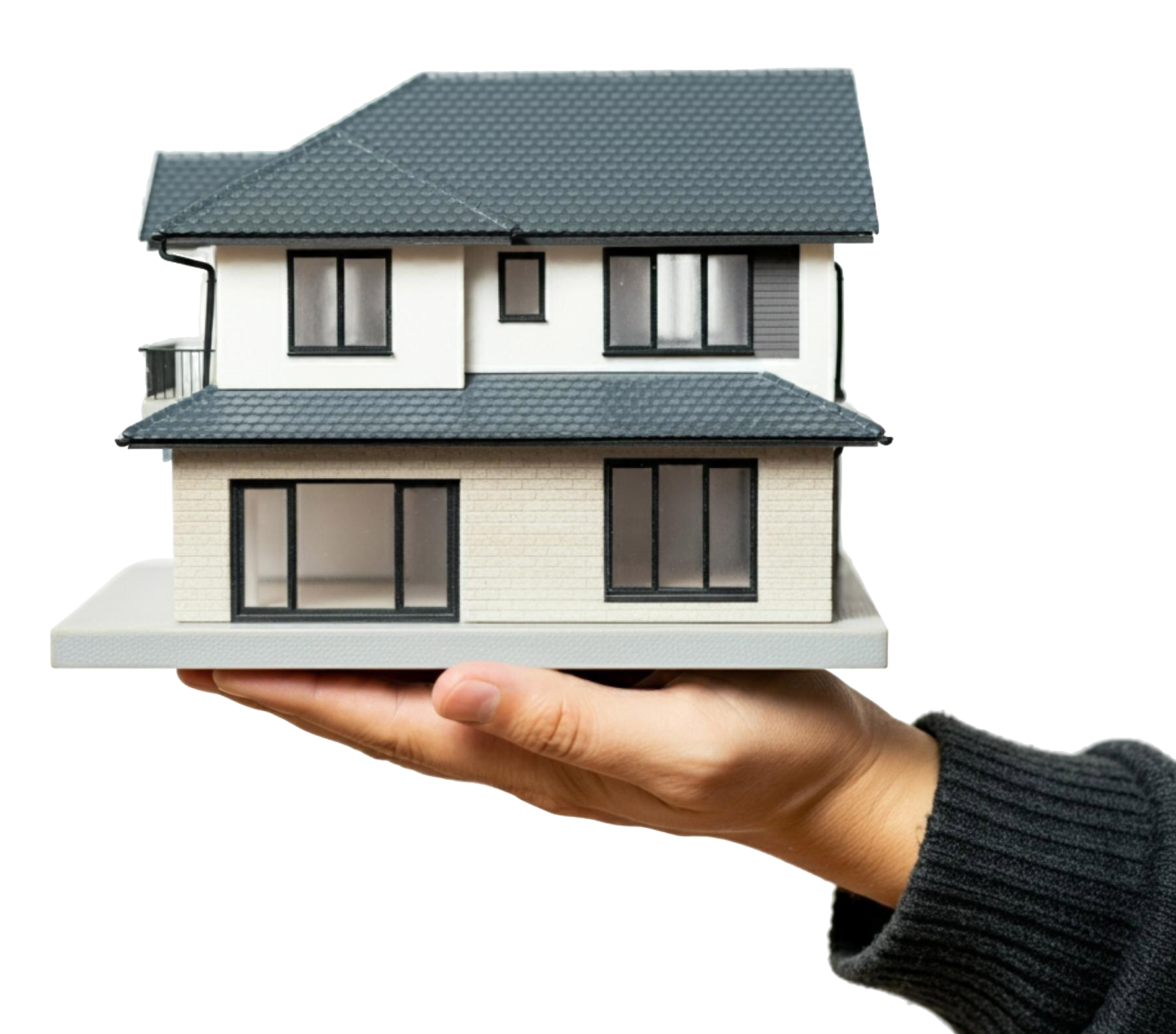 Hand holding house model